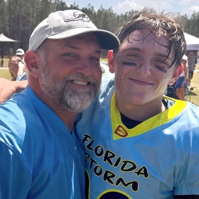 Brian and one of the boys at a football game
